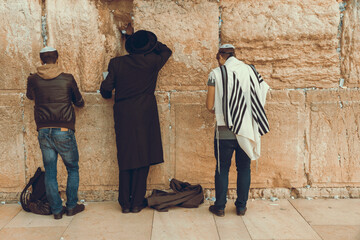 Jewish men praying at the sacred Wailing Wall, Western Wall, Jerusalem