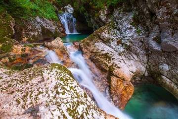 Wonderful turquoise Soca river in the Lepena valley, rocky part popular bathing place in summer - 558981684