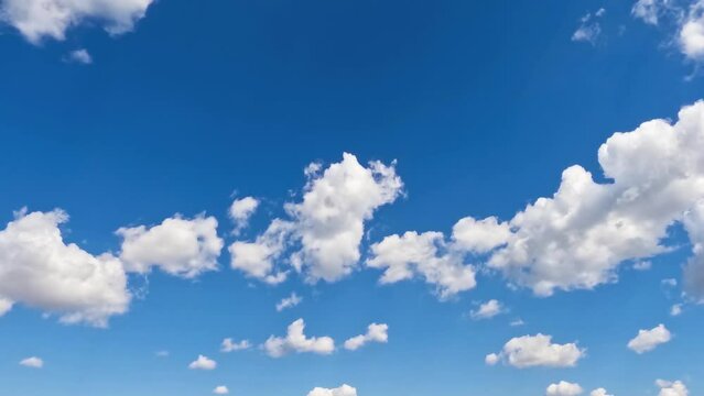 White clouds swirl in the blue sky.