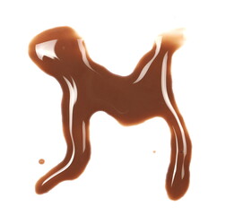 Spilled chocolate milk puddle in shape letter M isolated on white background, top view