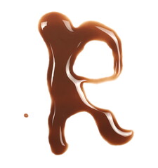 Spilled chocolate milk puddle in shape letter R isolated on white background, top view
