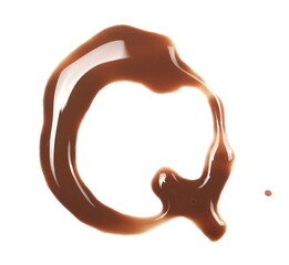 Spilled chocolate milk puddle in shape letter Q isolated on white background, top view