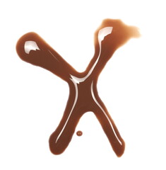 Spilled chocolate milk puddle in shape letter X isolated on white background, top view