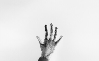 Painted female hand in black and white colors