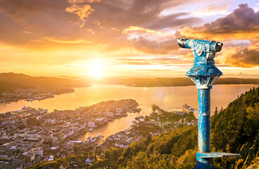 Amazing sunset view of City of Bergen from Floyen mountain and a public Binocular. Norway.