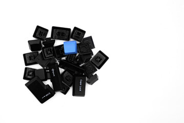 a pile of random computer keyboard keys isolated on a white background