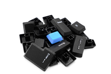 a pile of random computer keyboard keys isolated on a white background