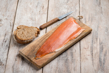 smoked trout over cutting board - 558992224