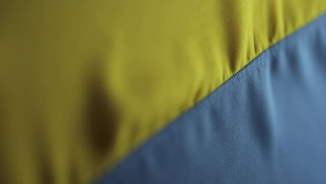 Yellow-blue Ukrainian flag.Vertical video State flag of Ukraine. Ukrainian flag, close-up. Vertical video.