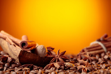 Roasted coffee beans with cinnamon sticks, anise, and nutmeg.