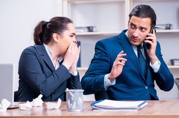 Two employees suffering at workplace