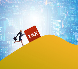 Businesswoman in tax concept on mountain