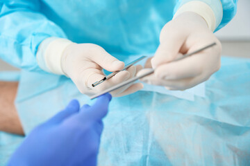 Doctor holds in his hands tools for installation of bioidentical hormones