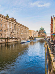 Fototapeta na wymiar Berlin Cathedral, Spree canal and historic buildings during a blue sky, Germany