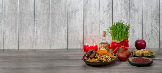 Festive table in honor of Navruz. Wheat with a red ribbon, the traditional holiday of the vernal equinox Nowruz. banner - obrazy, fototapety, plakaty