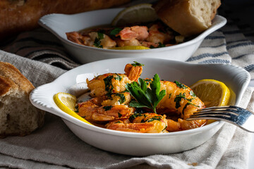 Shrimp scampi served with a crusty baguette