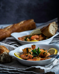Shrimp scampi served with a crusty baguette