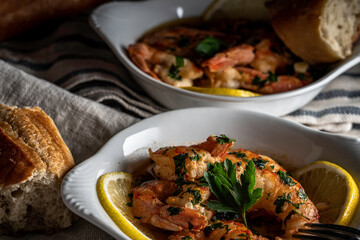 Shrimp scampi served with a crusty baguette
