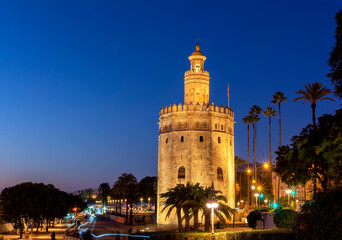 Fototapeta na wymiar Golden tower, Torre del Oro, at sunset in Seville, Andalusia. Spain.