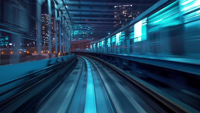 POV ride on the Yurikamome monorail in Minato, Tokyo, Japan at night