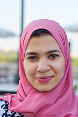 close up shot of a beautiful happy young woman wearing Islamic hijab 