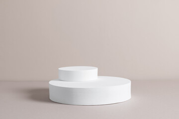 White round pedestal podium mockup on beige background. Front view. Place for text, copy space, mockup