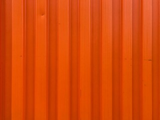 an orange angular corrugated metal wall