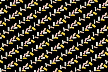 colorful marshmallows. pattern. on a black background.