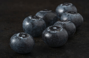 Fresh blueberries on dark background
