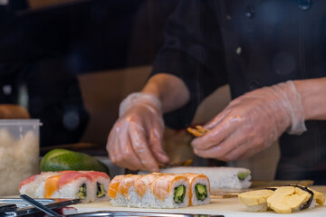 Chef preparing sushi in a restaurant