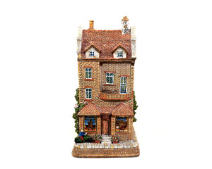 Obraz premium Miniature fairytale home toy on white background.