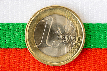 Euro coin on the background of the Bulgarian flag, Concept, Bulgaria's accession to the Eurozone,...