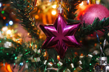Christmas tree decoration in the form of a star against the background of the shining fires. New Year's, Christmas background horizontally.