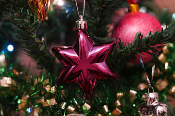 Christmas tree decoration in the form of a star against the background of the shining fires. New Year's, Christmas background horizontally.