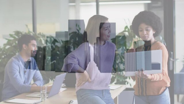 Animation of cityscape over diverse business people in office