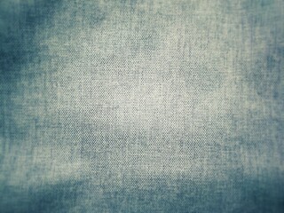 Defocus close-up of blue denim jeans fabric texture background. 