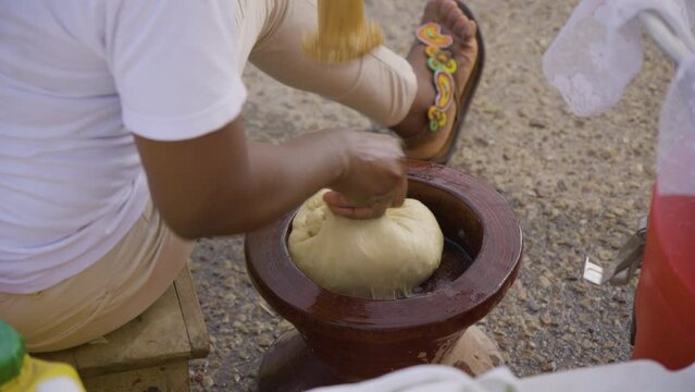 A woman prepares traditional food in Ghana.