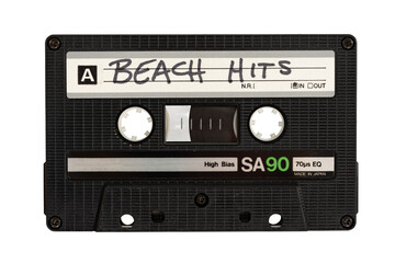 Isolated close up of a cassette tape labeled Beach Hits
