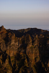 Amazing sunset on Pico Ruivo with a view of Pico do Arieiro during the golden hour, perfect for photography.
