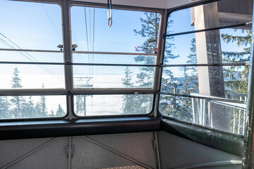 A view of empty Skyride Gondola at The Peak of Vancouver inside the Grouse Mountain Ski Resort © Margarita