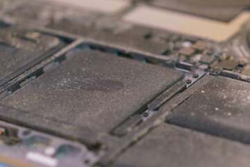 Dust on the battery inside a laptop. Messy. Grimy. Untidy. Careless. Cleaner. Specialist. Clogged....