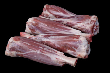 Fresh raw meat of lamb leg. Raw lamb leg isolated on black background. ossobuco (lamb shank steak...
