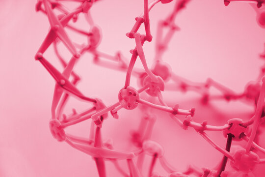 Hoberman sphere. Folding ball of rainbow colors on a light background.