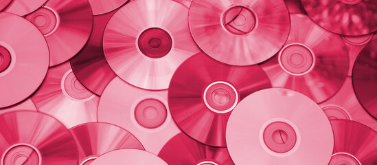 Lots of old CDs are laid out as a background.