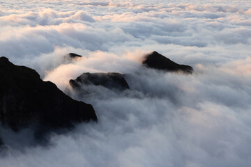 Amazing sunset over the clouds of Funchal, Madeira observed from the top of Pico Ruivo.