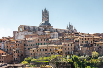 Fototapeta na wymiar Siena, Italy, 17 April 2022: Beautiful cityscape of the medieval historic center