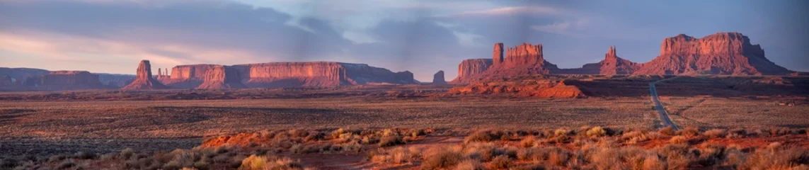 Poster Sunset at Monument Valley, panoramic photo of monument valley, Highway 163, Utah, USA © Larry Zhou
