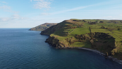 The beautiful Causeway Coast in Northern Ireland - aerial view by drone - obrazy, fototapety, plakaty