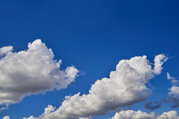 Naklejka na ściany i meble Sunny sky. Cloudscape Background. Close up of clouds