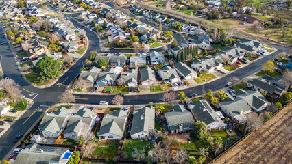 Drone photo over a suburb in Oakley, Calfornia with roads and houses